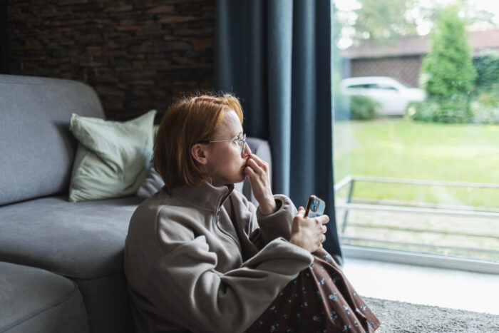 woman sitting in window